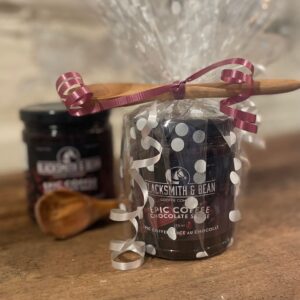Chocolate dipping sauce with wooden spoon