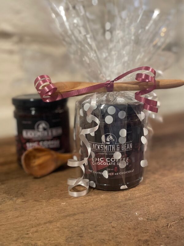 Chocolate dipping sauce with wooden spoon